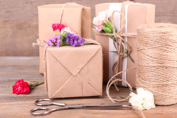 Beautiful gifts with flowers - Photo, image