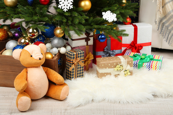 Lots of Christmas gifts on floor in festive interior - Fotoğraf, Görsel