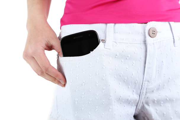 Teléfono inteligente en jeans de bolsillo de cerca
 - Foto, imagen
