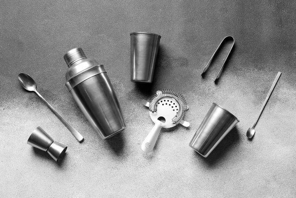 Different bartender utensils on white and black background - Photo, Image