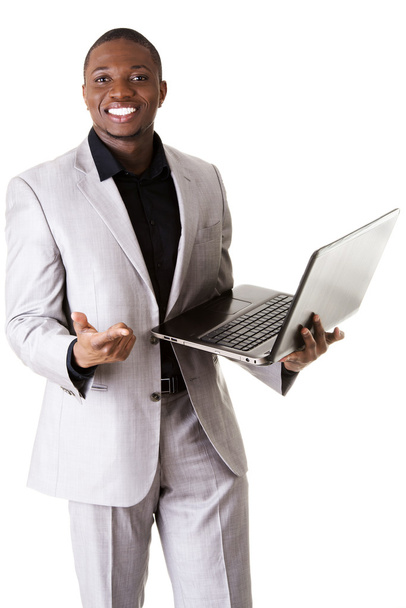 Black man standing with the laptop - 写真・画像