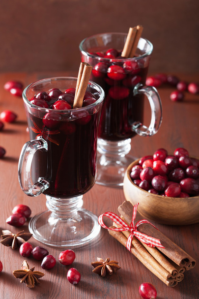 glass of mulled wine with cranberry and spices, winter drink - Photo, Image