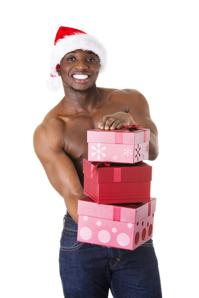 Black man holding christmas gifts - Foto, afbeelding