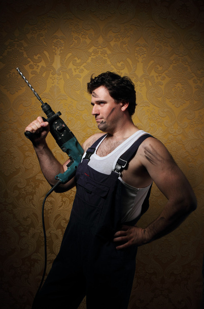 Builder with professional puncher-hammer - Fotó, kép