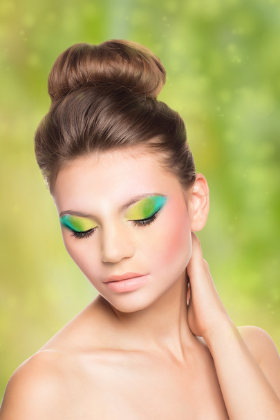 Colorful Makeup. Beauty Fashion Model Girl. Colourful Make up for Blue eyes. Portrait of a Beautiful Girl with professional hair styling. - Valokuva, kuva
