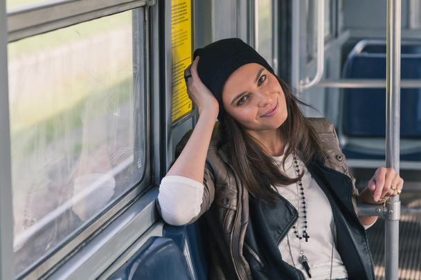 Pretty girl posing in a metro car - Valokuva, kuva