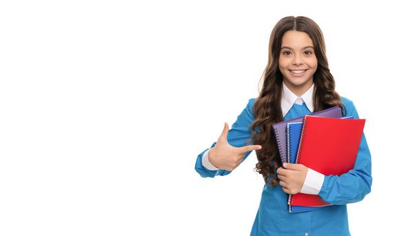 happy face of teen girl directing on school workbook isolated on white, education. - Foto, Imagen