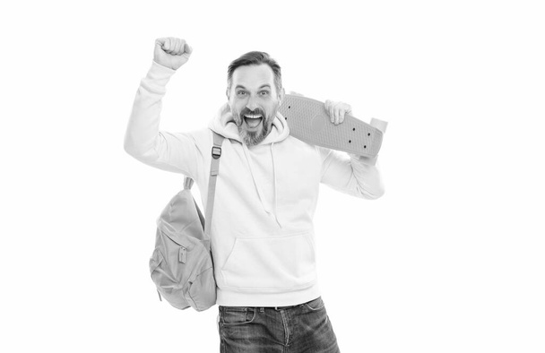 happy handsome mature man hipster with backpack and penny board isolated on white, skateboarder. - Fotografie, Obrázek