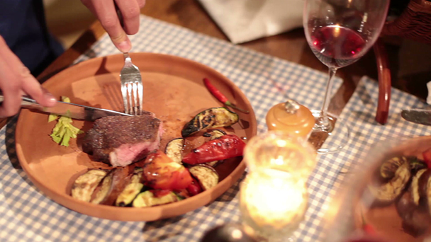 Restaurant visitors enjoying grilled steak - Footage, Video