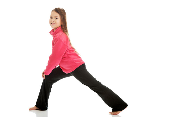 Girl doing gymnastics exercise - Fotó, kép