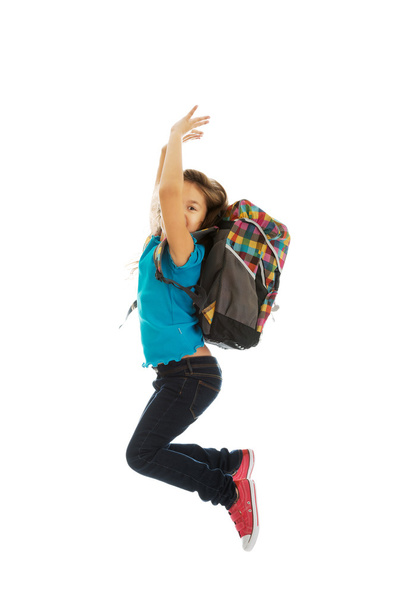 Girl with bag jumping high - Foto, Imagen