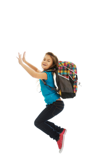 Girl with bag jumping high - Fotó, kép