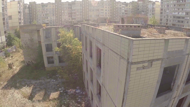 Aerial view wrecked abandoned building - Metraje, vídeo