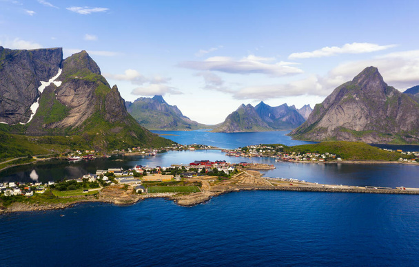 Reine fishing village surrounded by high mountains and fjords on Lofoten islands - Foto, afbeelding
