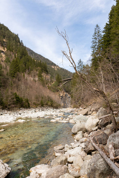 Rania, Grison, Switzerland, April 12, 2022 Small part at the beginning of the rhine river in the alps - Фото, изображение