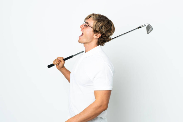 Inglês homem jogando golfe rindo em posição lateral - Foto, Imagem