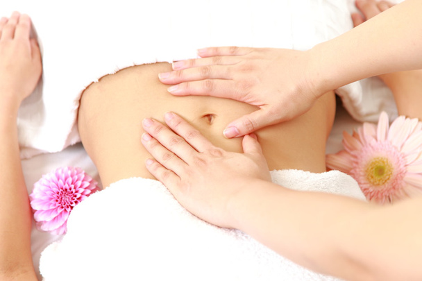 Woman getting a stomach massage　 - Foto, Imagem
