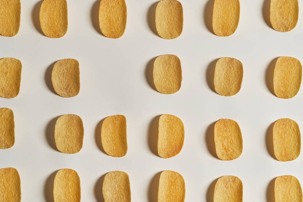 Set of crispy potato chips in rows with copy space - Zdjęcie, obraz