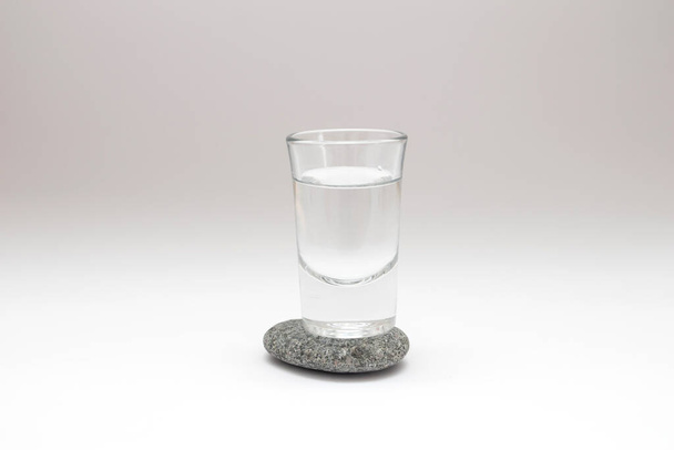 Shot of drink on stone. - Foto, Imagen