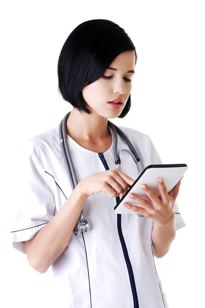 Female doctor using a tablet - Fotoğraf, Görsel