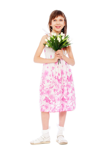 Cheerful little girl with bunch of tulips - Φωτογραφία, εικόνα