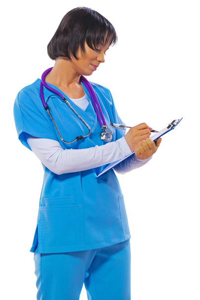 asian female doctor writing in clipboard and looking on it isola - Fotoğraf, Görsel