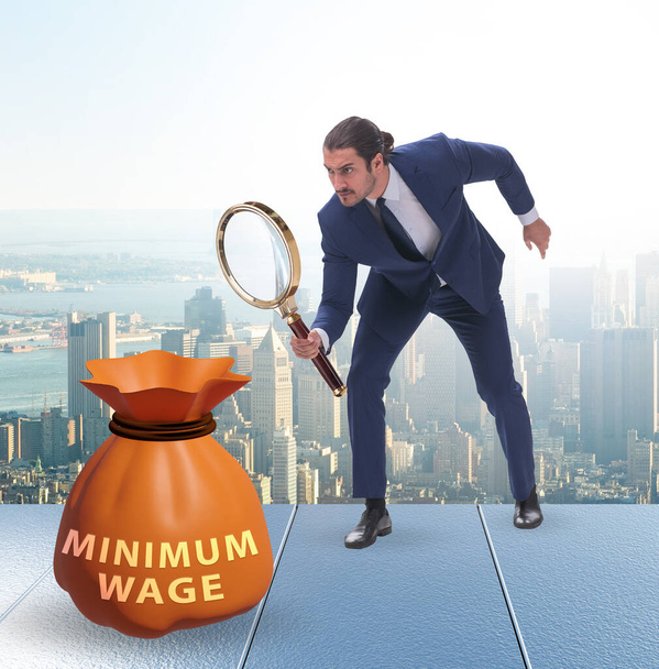 Concepto de salario mínimo con empresario
 - Foto, Imagen