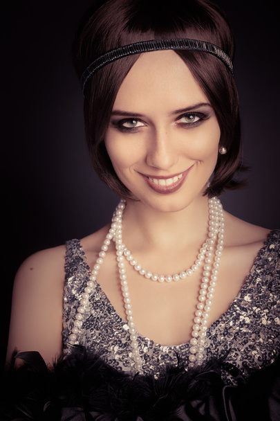 Beautiful retro woman 20s style in silver dress - Photo, Image
