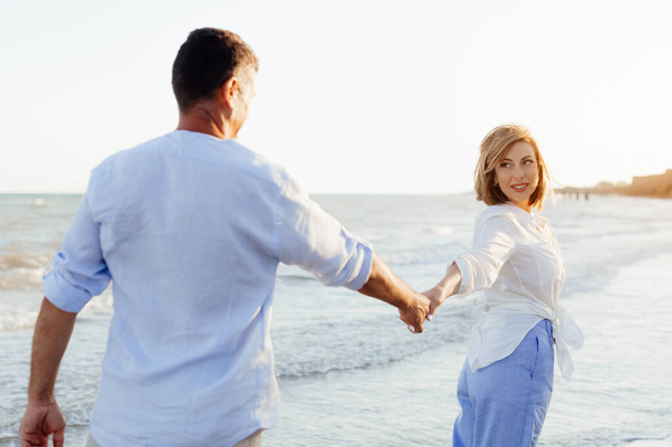 Happy romantic middle aged couple are by the sea. Lifestyle Concept. Closeup photo. - Photo, Image