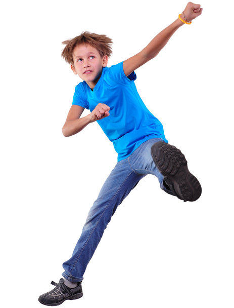 cute elementary boy  jumping and dancing over white - Zdjęcie, obraz