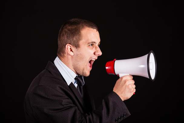 Businessman screaming in megaphone - Foto, imagen