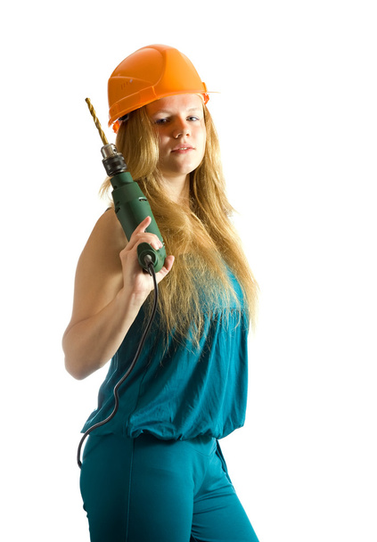 Girl in hardhat with drill - Фото, изображение
