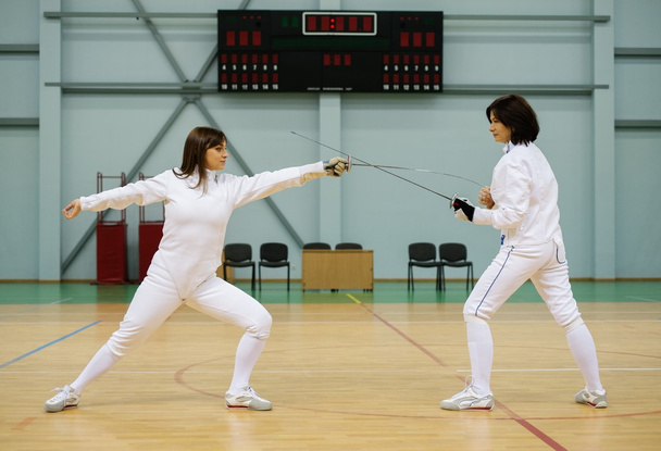 Young woman fencer and her trainer  - Photo, Image