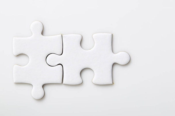 Six white blank puzzle pieces on a white background Merging different elements into a whole, clipping path - Photo, Image