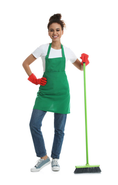 African American woman with green broom on white background - Photo, Image