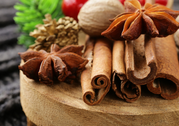 Spices anise, cinnamon, nutmeg on warm knitted background - Photo, Image