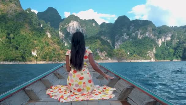 Khao Sok Thailand, woman on vacation in Thailand, girl in longtail boat at the Khao Sok national park Thailand - Footage, Video