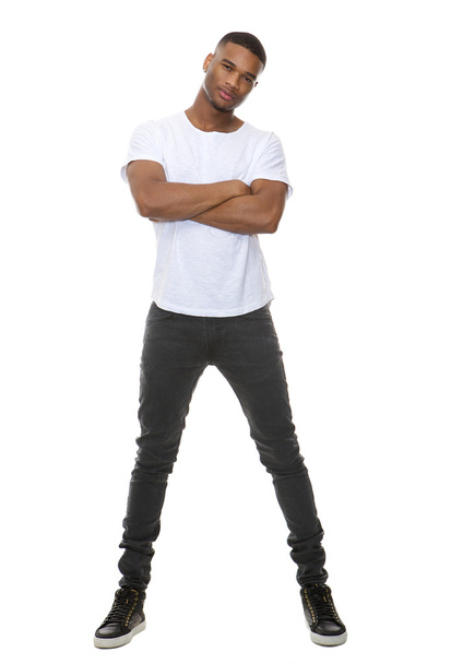 Portrait of a confident young man posing with arms crossed  - Foto, Imagem