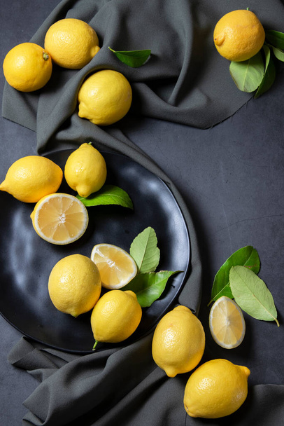 Raw fresh lemons. Harvest, agricultural concept, healthy organic ingredients - Фото, зображення