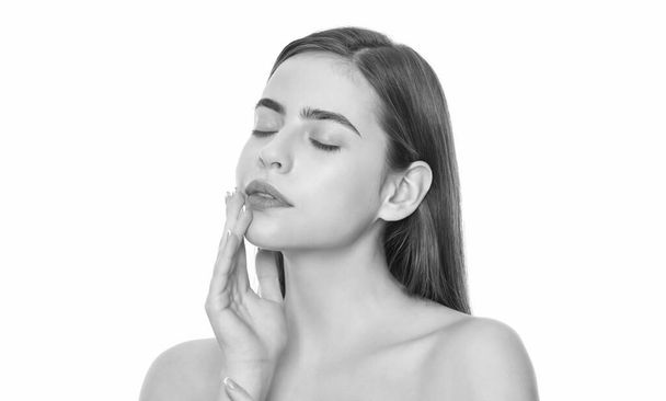young woman touch soft face skin with closed eyes isolated on white background, skincare - Foto, Bild