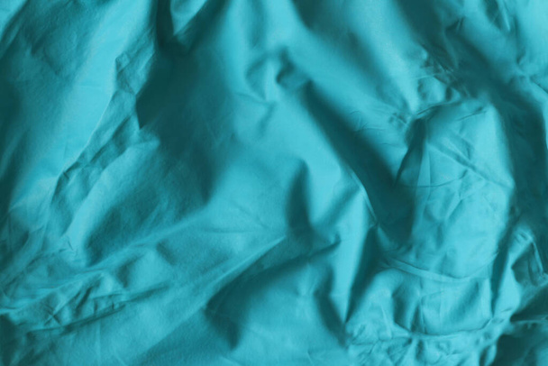 Texture of blue crumpled rubber balloon. Crumpled rubber of a children's balloon. - Photo, Image