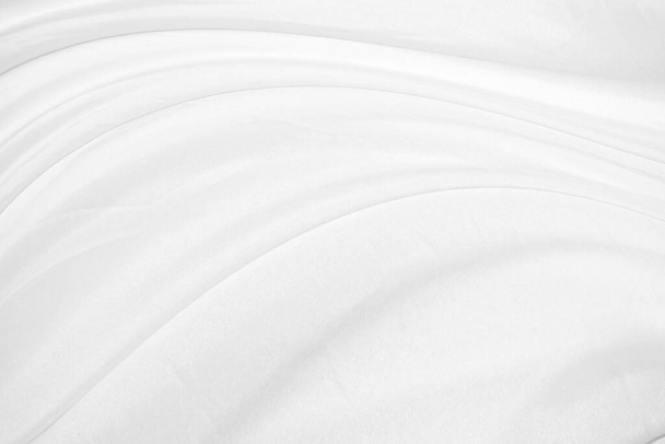 Textures Background Abstract white fabric background pattern with soft waves is suitable for a dress or suit where transparency and flow are required. - Фото, зображення