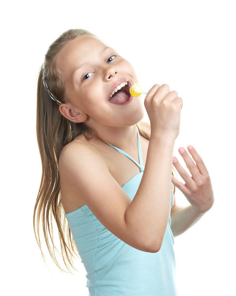 Cheerful little girl with lollipop singing - Foto, Imagem