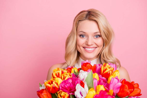 Photo of sweet cute lady dressed glamour outfit holding tulips bouquet empty space isolated pink color background - Φωτογραφία, εικόνα
