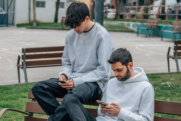 young people in the street with mobile phone - Photo, image