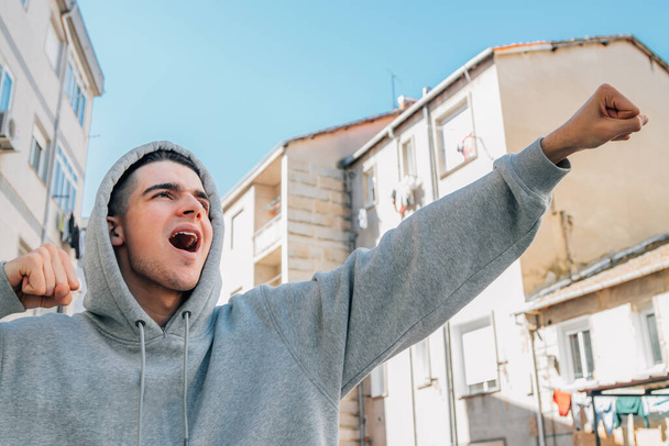 excited teen millennial celebrating success - Foto, afbeelding