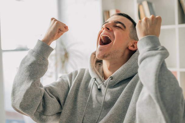 teen boy excited with joy celebrating success - Photo, Image