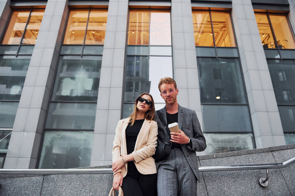 Woman and man in the town at daytime. Well dressed people. - Foto, imagen