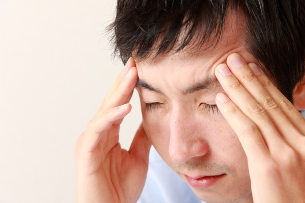 Man suffers from headache - Foto, Bild