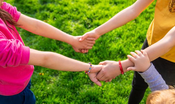 Children walk together holding hands. Selective focus. Kids. - Foto, Imagem